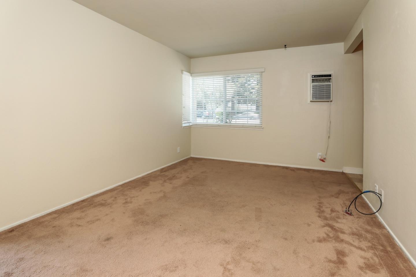 494 Dover Way Campbell, CA 95008 - Photo 9 of 28 an empty room with windows