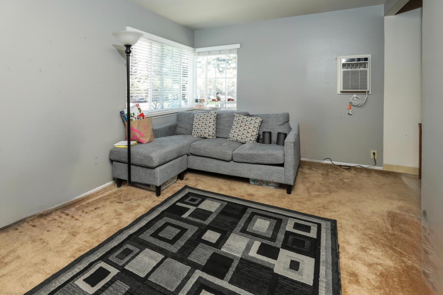 494 Dover Way Campbell, CA 95008 - Photo 10 of 28 a living room with furniture and a rug