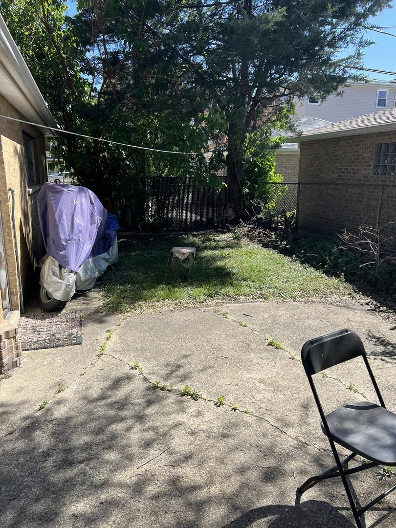 Undisclosed Address River Grove, IL 60171 - Photo 3 of 3 a view of backyard with trampoline