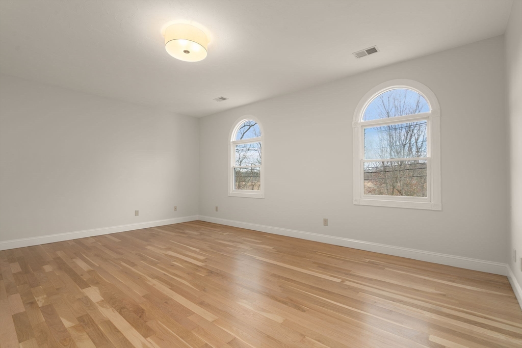 140 York Street Canton, MA 02021 - Photo 19 of 27 an empty room with windows and natural light