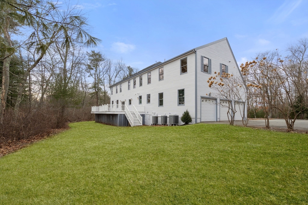 140 York Street Canton, MA 02021 - Photo 25 of 27 a view of a house with backyard and trees