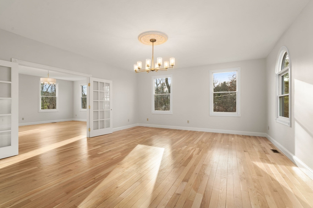 140 York Street Canton, MA 02021 - Photo 10 of 27 a view of an empty room with wooden floor and a window