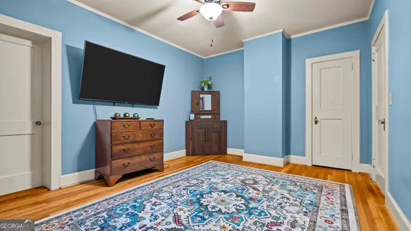 a living room with furniture and a flat screen tv
