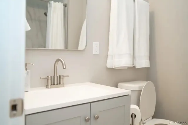 a bathroom with a sink and a vanity