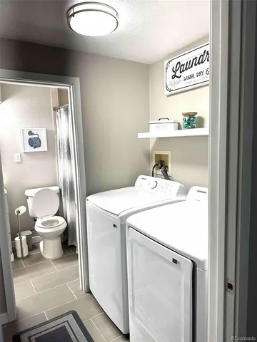 a bathroom with a toilet a sink and a mirror