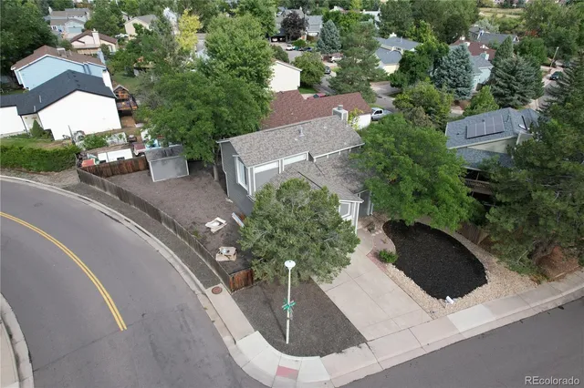an aerial view of a house with outdoor space