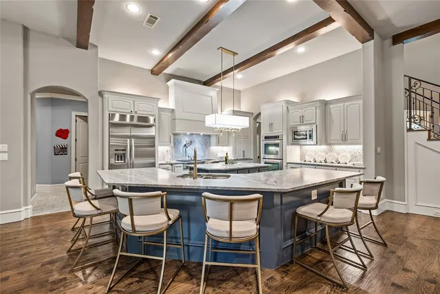 a kitchen with a dining table and chairs
