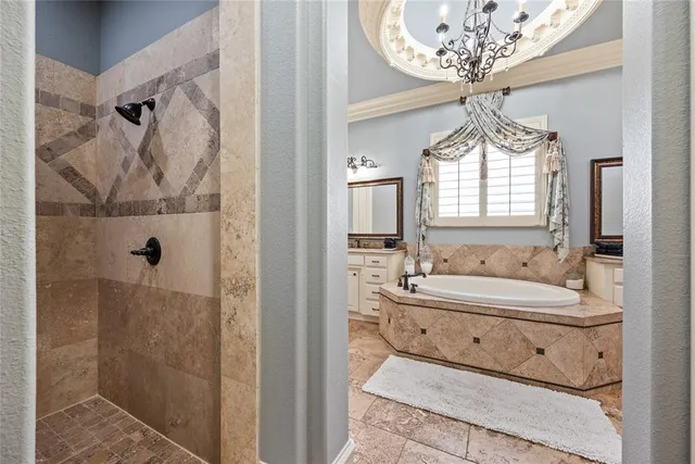 a bathroom with a double vanity sink mirror and shower