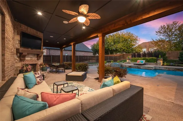 a outdoor living space with patio furniture and a fireplace