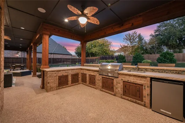 a open kitchen with stainless steel appliances granite countertop a stove and a sink
