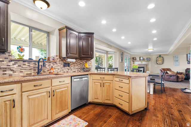 5727 South 3550th Street West Roy, UT 84067 - Photo 22 of 49 Kitchen with hardwood flooring, two-tone cabinetry, granite countertops, and a mosaic tile backsplash