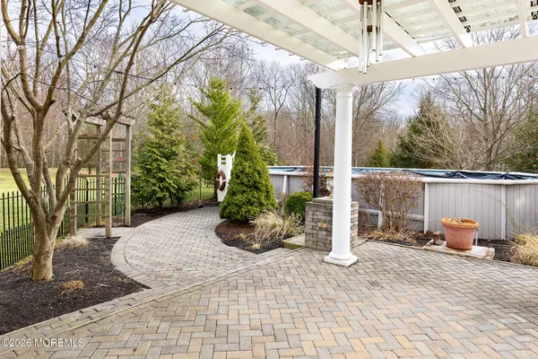 a pathway of a house with a yard
