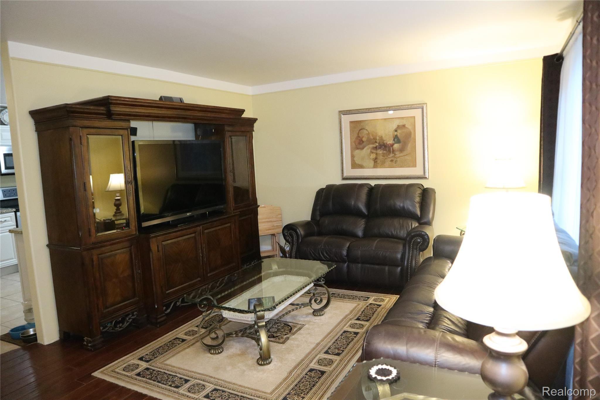 2947 East Schafer Road Howell, MI 48843 - Photo 36 of 48 COZY LIVING ROOM WITH BEAUTIFUL HARDWOOD FLOORS