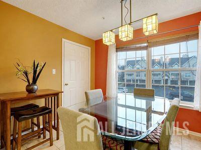 31 Edinburgh Court Edison, NJ 08820 - Photo 12 of 25 a view of a dining room with furniture window and outside view