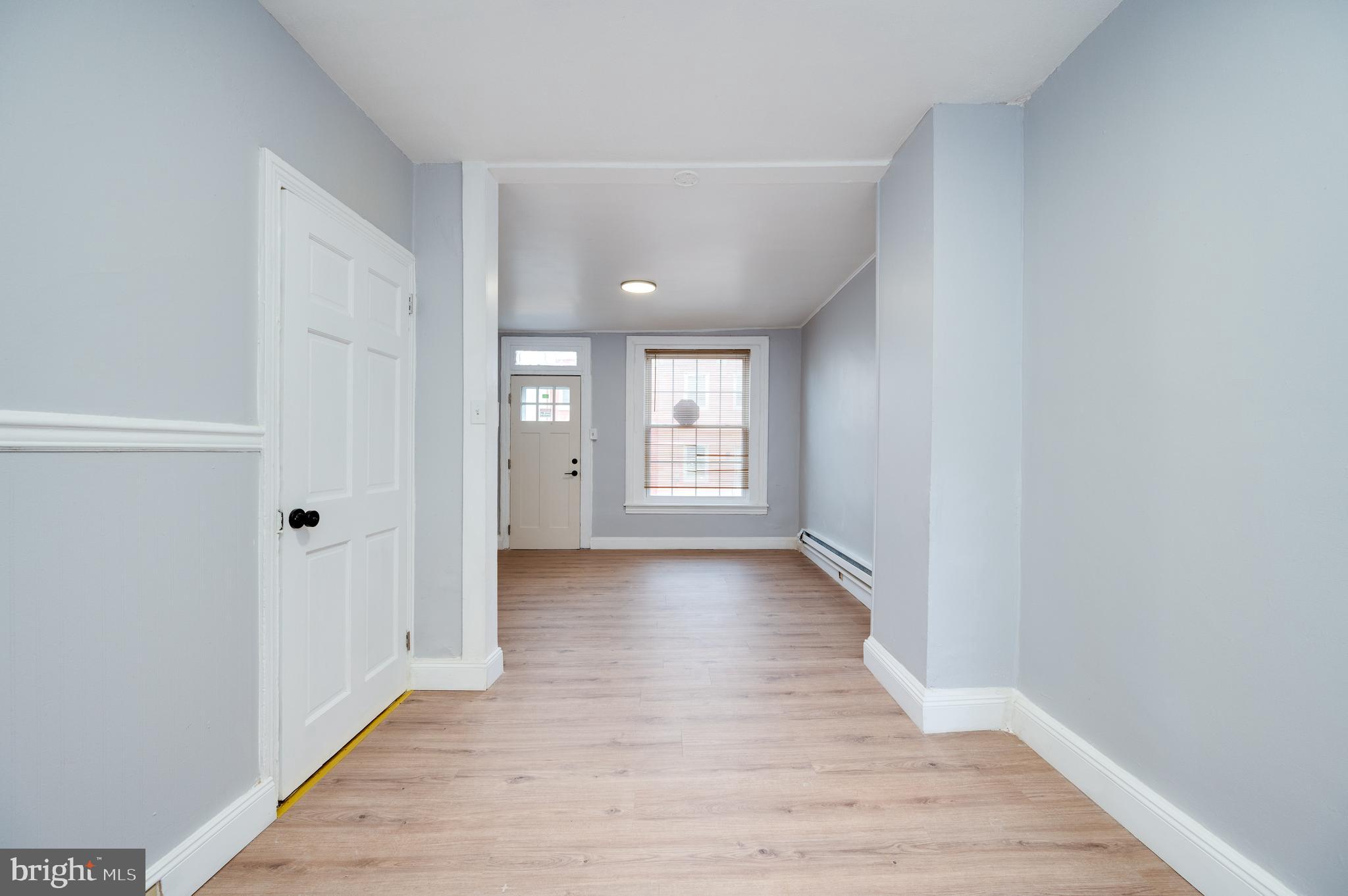 1724 Cotton Street Reading, PA 19606 - Photo 3 of 29 a view of a hallway with wooden floor and closet