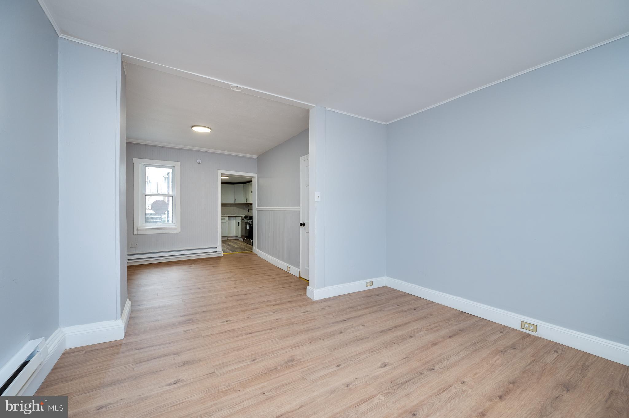 1724 Cotton Street Reading, PA 19606 - Photo 4 of 29 a view of empty room with wooden floor and window