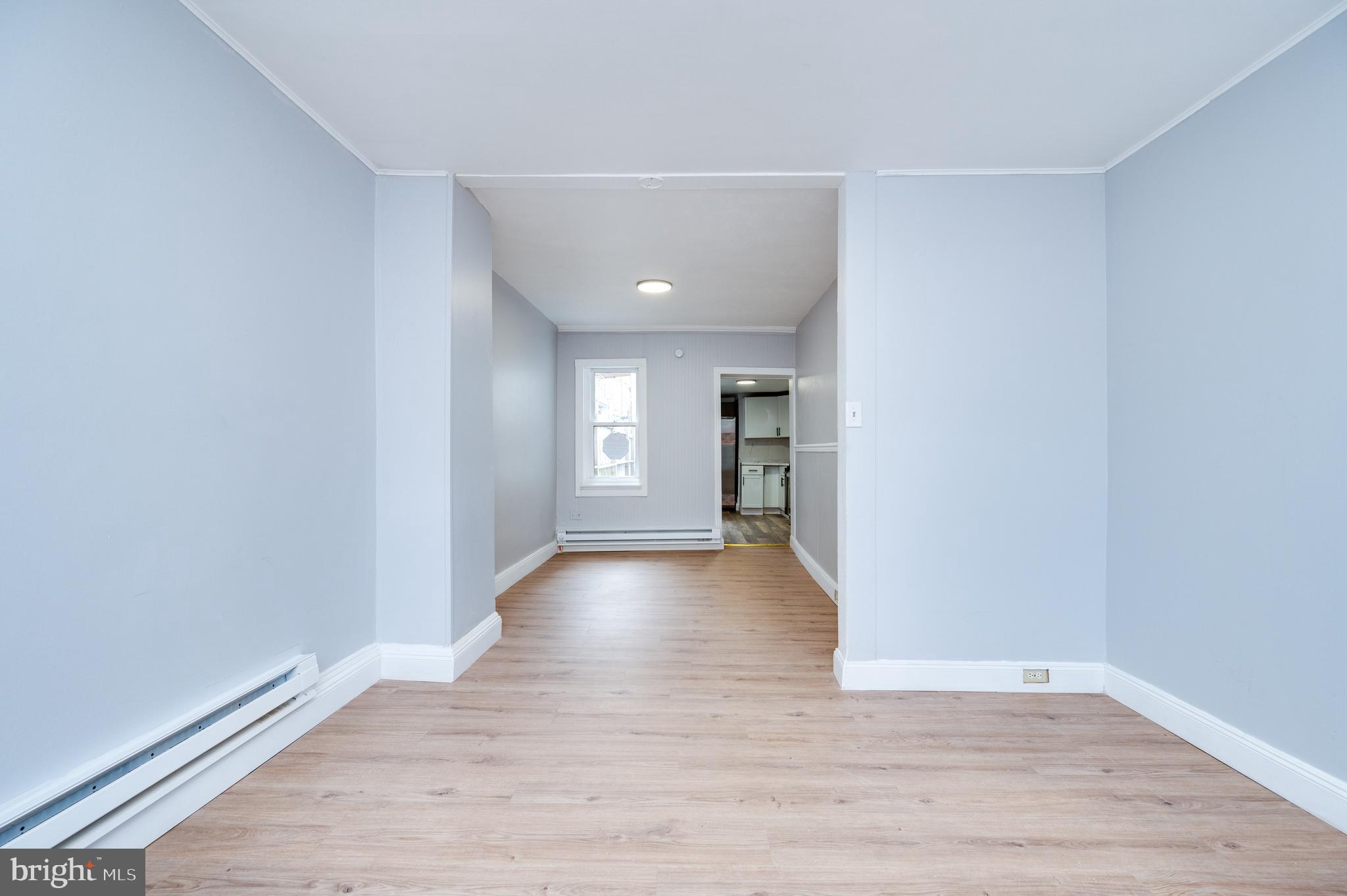 1724 Cotton Street Reading, PA 19606 - Photo 5 of 29 a view of a room with wooden floor and windows