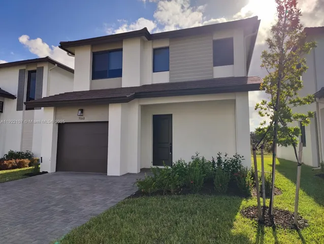 a house view with a backyard space