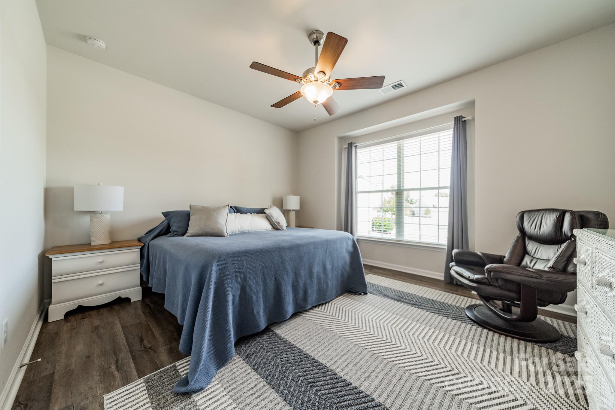 508 Vermeer Court Mount Holly, NC 28120 - Photo 14 of 24 a bedroom with a bed a couch and a window