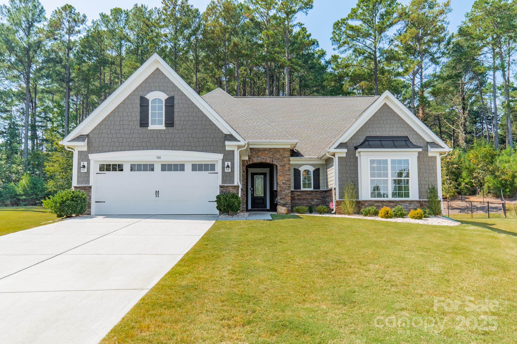 508 Vermeer Court Mount Holly, NC 28120 - Photo 2 of 24 a front view of a house with a yard