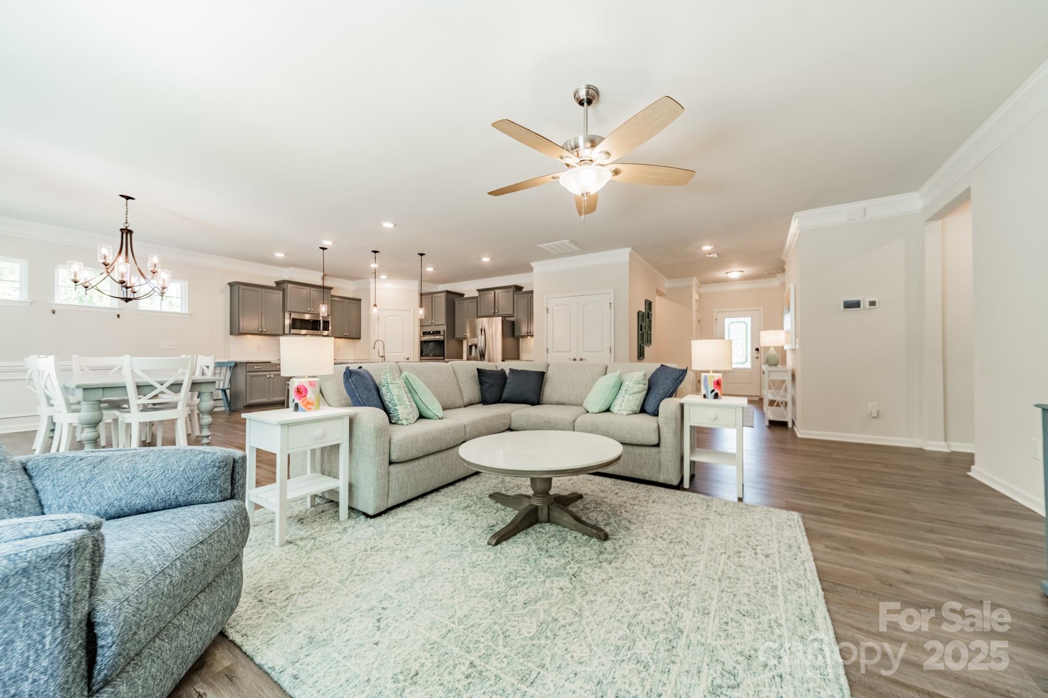 508 Vermeer Court Mount Holly, NC 28120 - Photo 4 of 24 a living room with furniture and a dining table with kitchen view