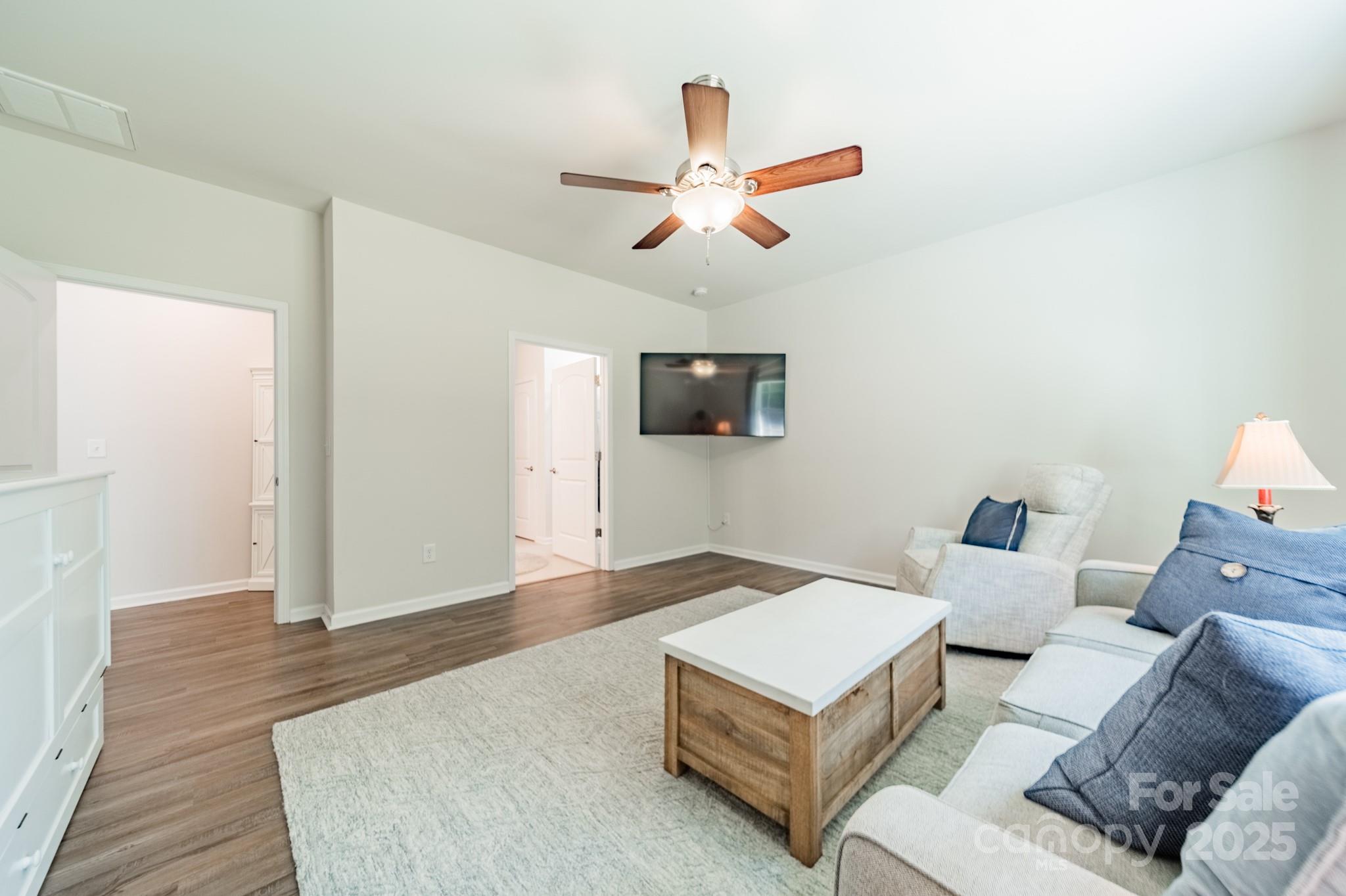 508 Vermeer Court Mount Holly, NC 28120 - Photo 10 of 24 a living room with furniture and a flat screen tv