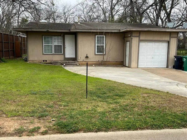a house that has tree in front of it