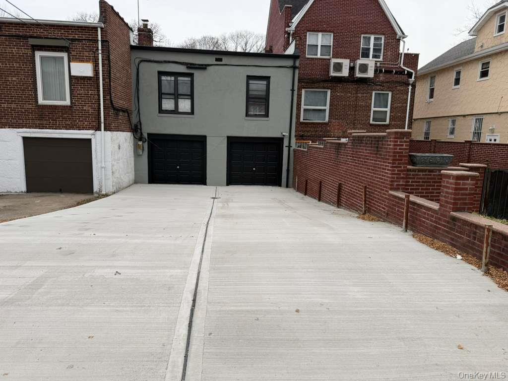 108-39 Union Turnpike Queens, NY 11375 - Photo 12 of 13 a front view of a house with yard