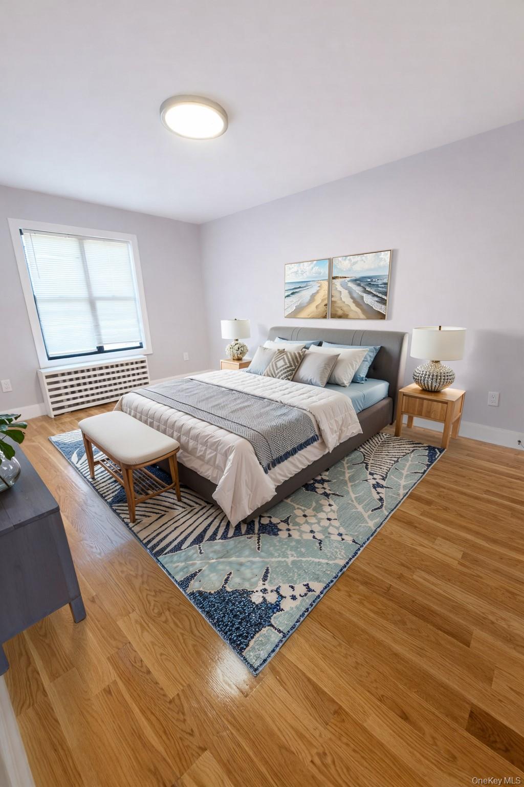 108-39 Union Turnpike Queens, NY 11375 - Photo 6 of 13 a spacious bedroom with a bed and wooden floor