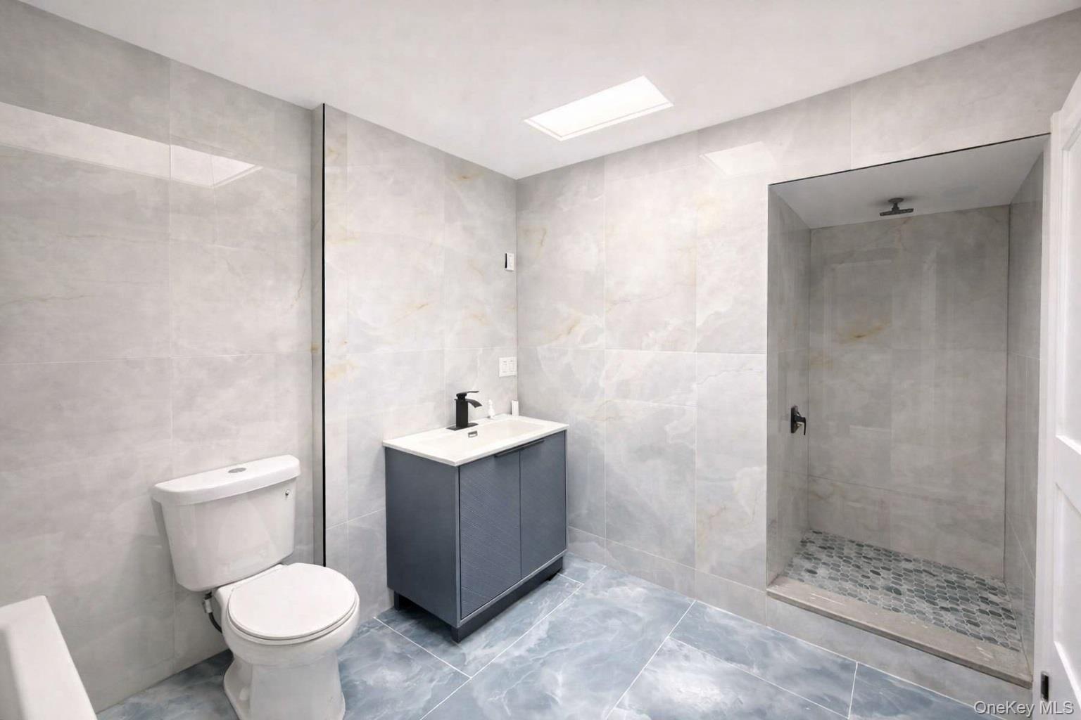 108-39 Union Turnpike Queens, NY 11375 - Photo 9 of 13 a bathroom with a toilet sink and shower