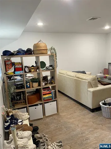 a room with furniture a rug and gym equipment