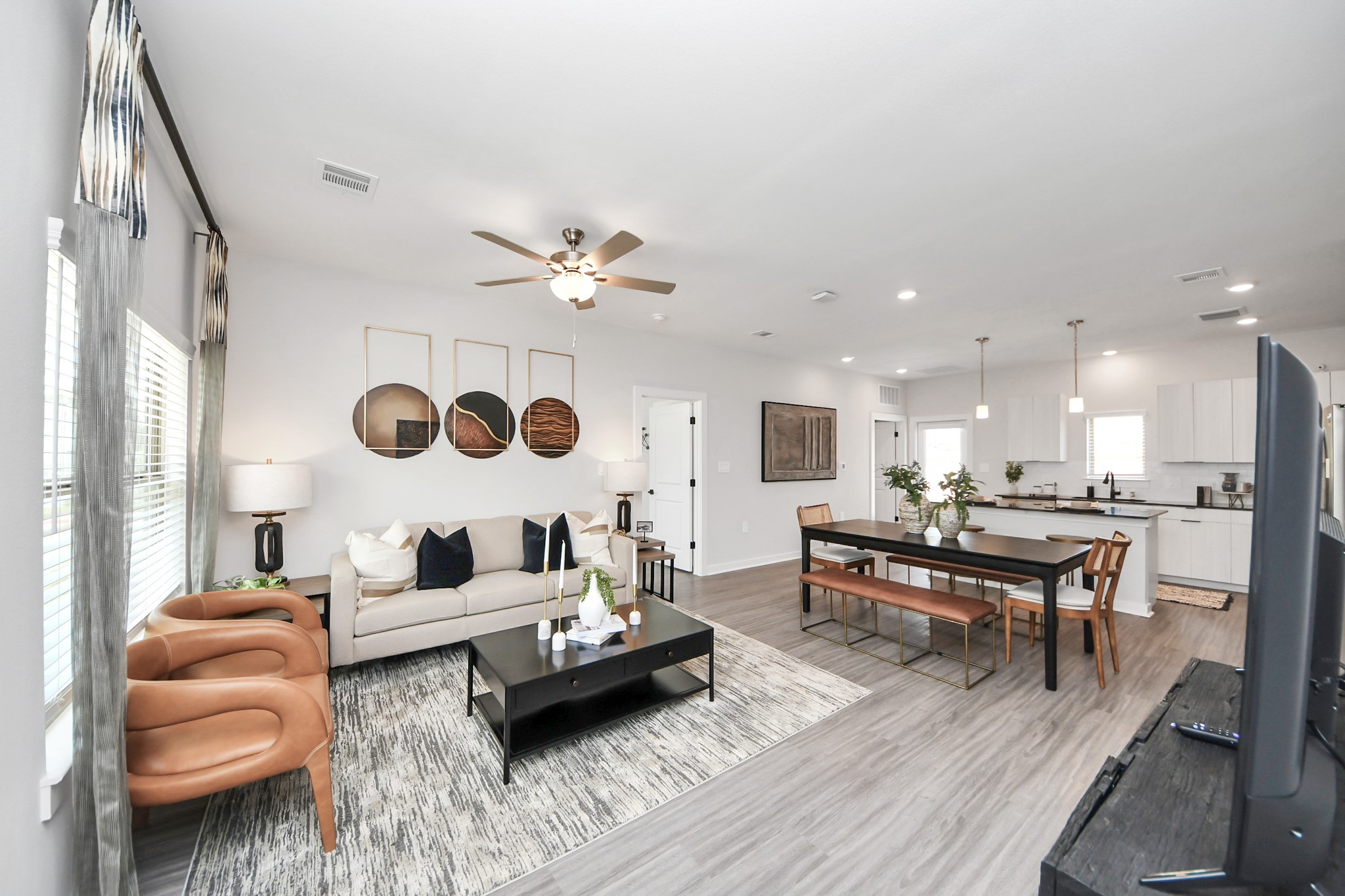 7711 Longmire Road, Unit 2 Conroe, TX 77304 - Photo 35 of 48 Boasting luxury finishes-stylish Island kitchen,granite counters,subway tile backsplash,ample custom cabinet space,stainless appliances,refrigerator,full size washer&dryer included,wood-like flooring throughout,open concept floor plan.