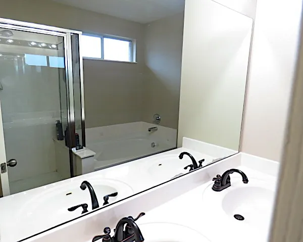 a bathroom with a tub and a sink