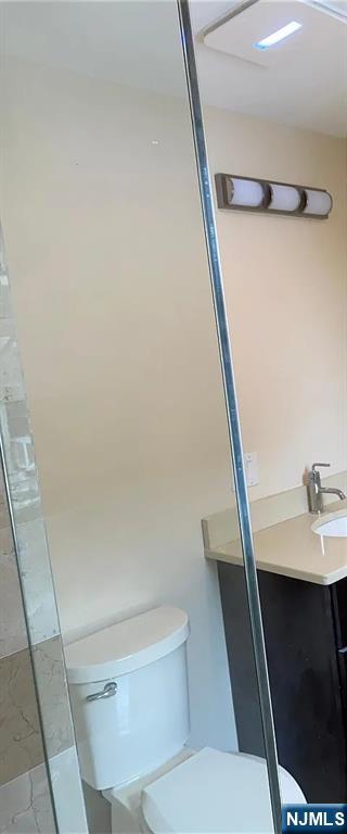 353 Hoboken Road Carlstadt, NJ 07072 - Photo 8 of 12 a bathroom with a sink a toilet and a shower