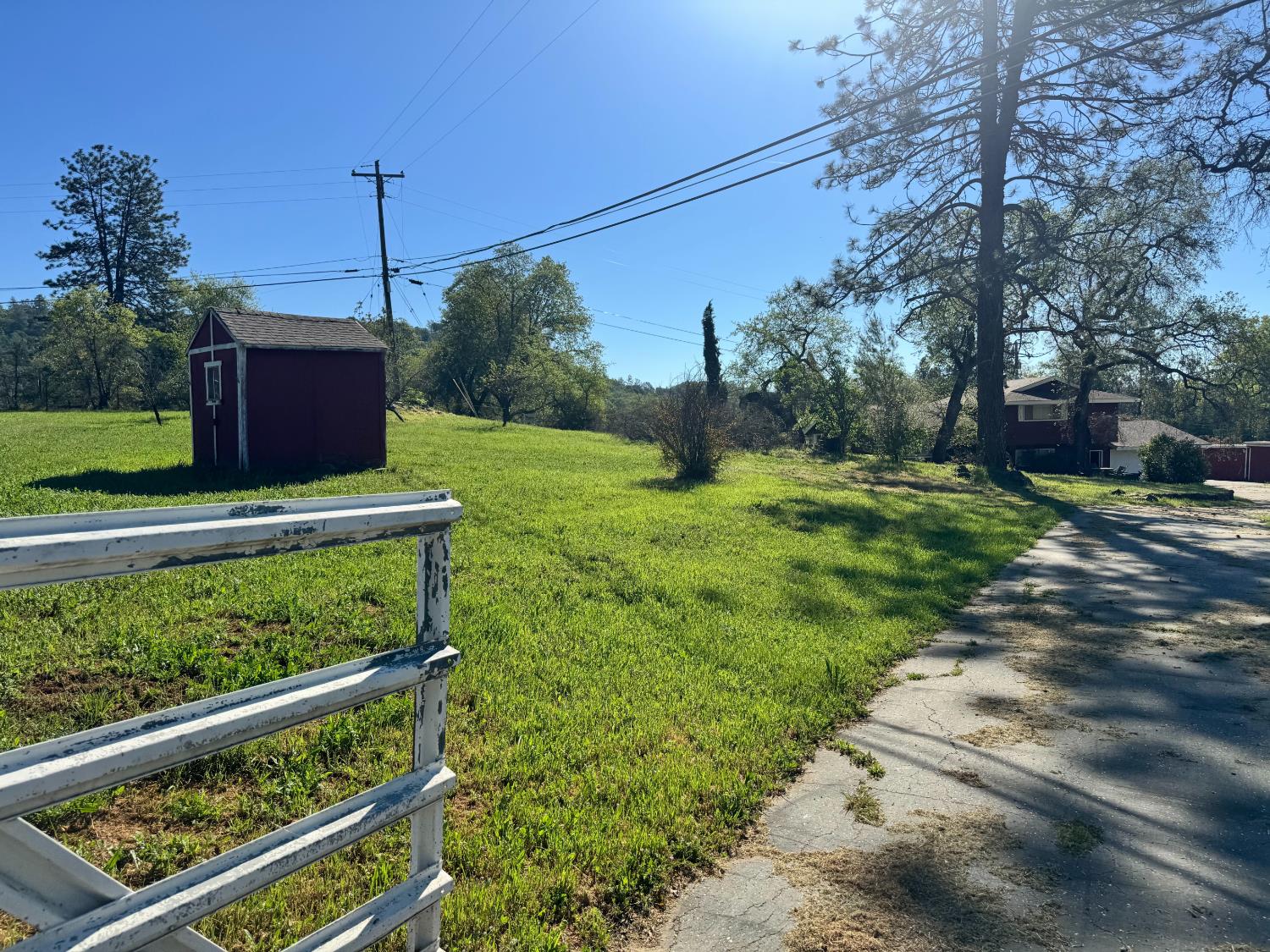 13080 Lone Star Road Auburn, CA 95602 - Photo 13 of 14 a view of a yard with wooden fence