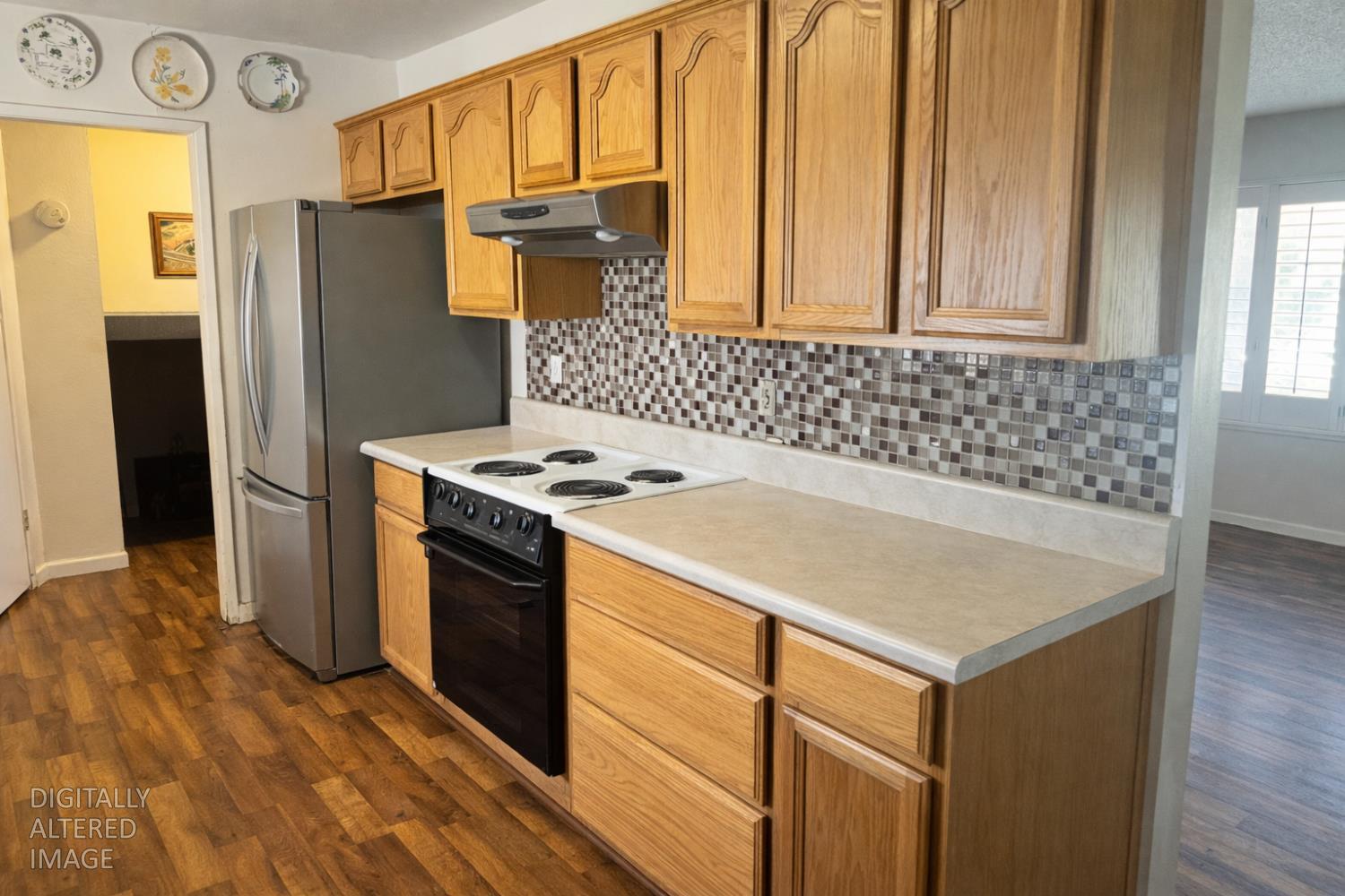 13080 Lone Star Road Auburn, CA 95602 - Photo 8 of 14 a kitchen with stainless steel appliances a refrigerator and a stove