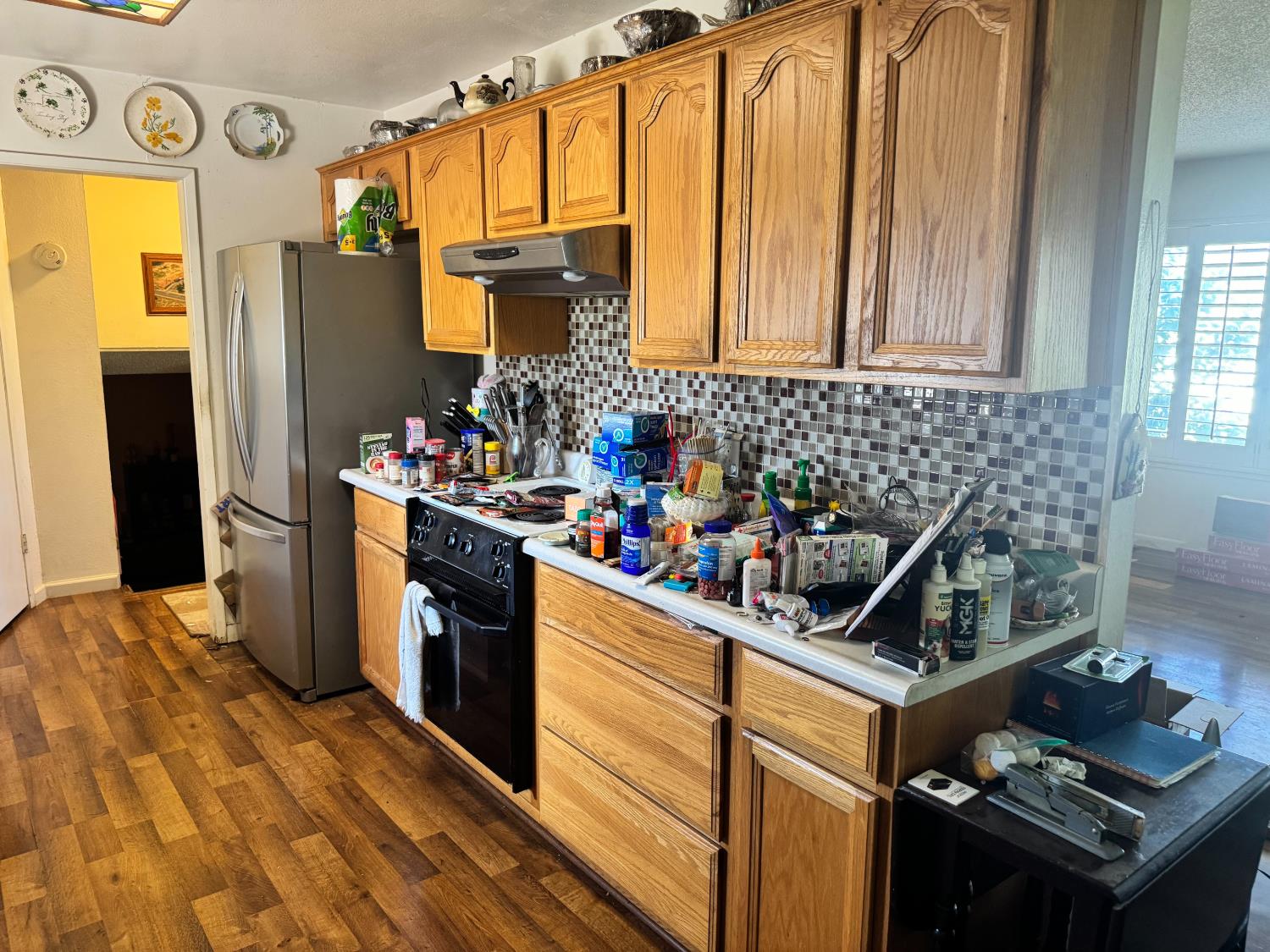 13080 Lone Star Road Auburn, CA 95602 - Photo 9 of 14 a kitchen with stainless steel appliances granite countertop a refrigerator stove and sink