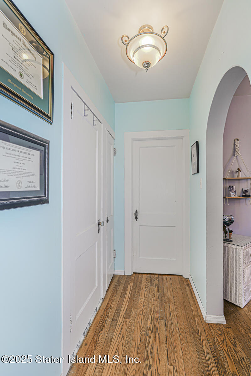 334 Neal Dow Avenue Staten Island, NY 10314 - Photo 15 of 37 a view of a room with wooden floor and staircase