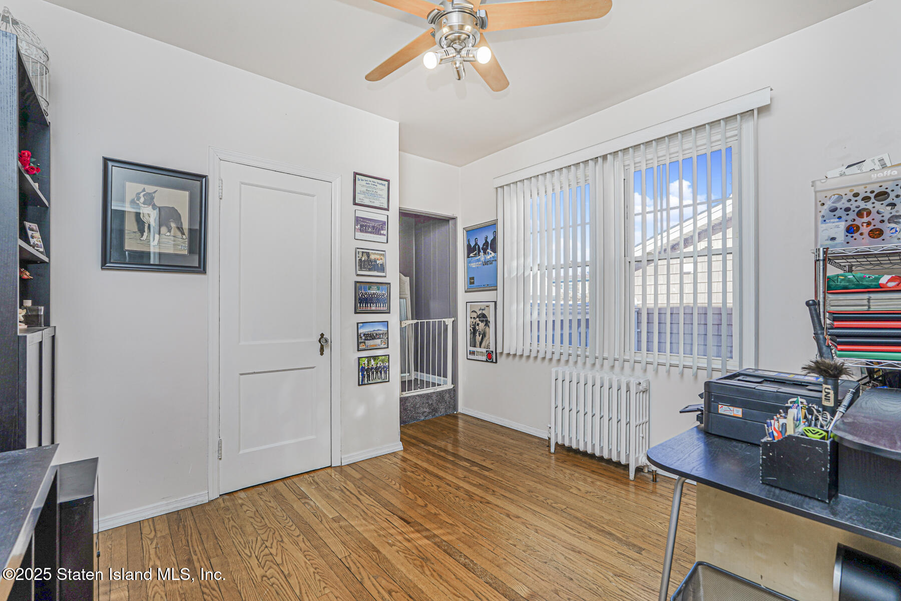 334 Neal Dow Avenue Staten Island, NY 10314 - Photo 20 of 37 a view of a livingroom with wooden floor and a window