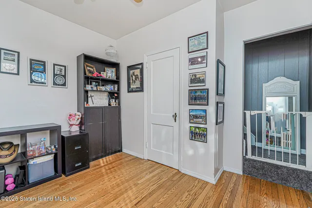 a bedroom with a bed and a book shelf