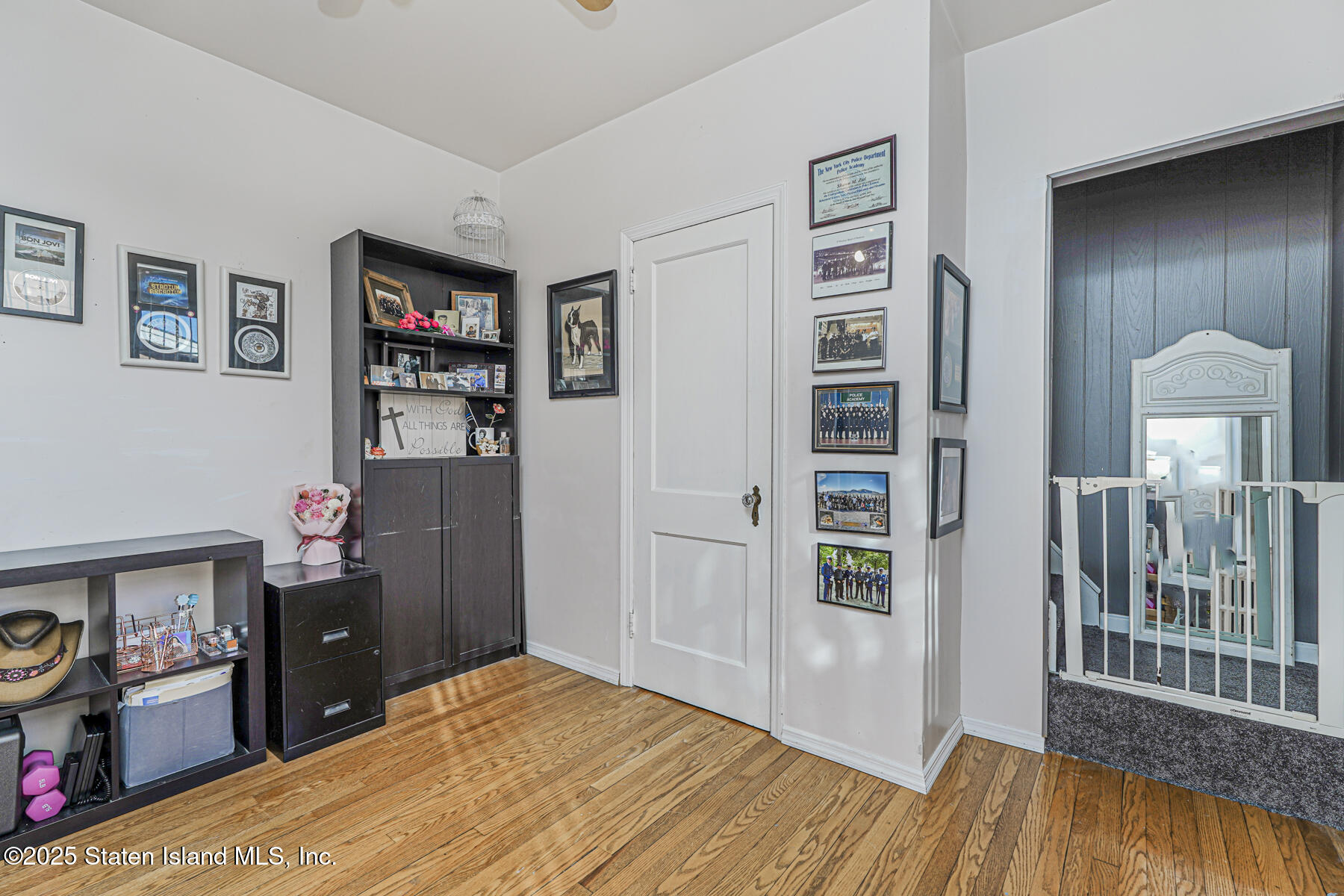 334 Neal Dow Avenue Staten Island, NY 10314 - Photo 21 of 37 a bedroom with a bed and a book shelf
