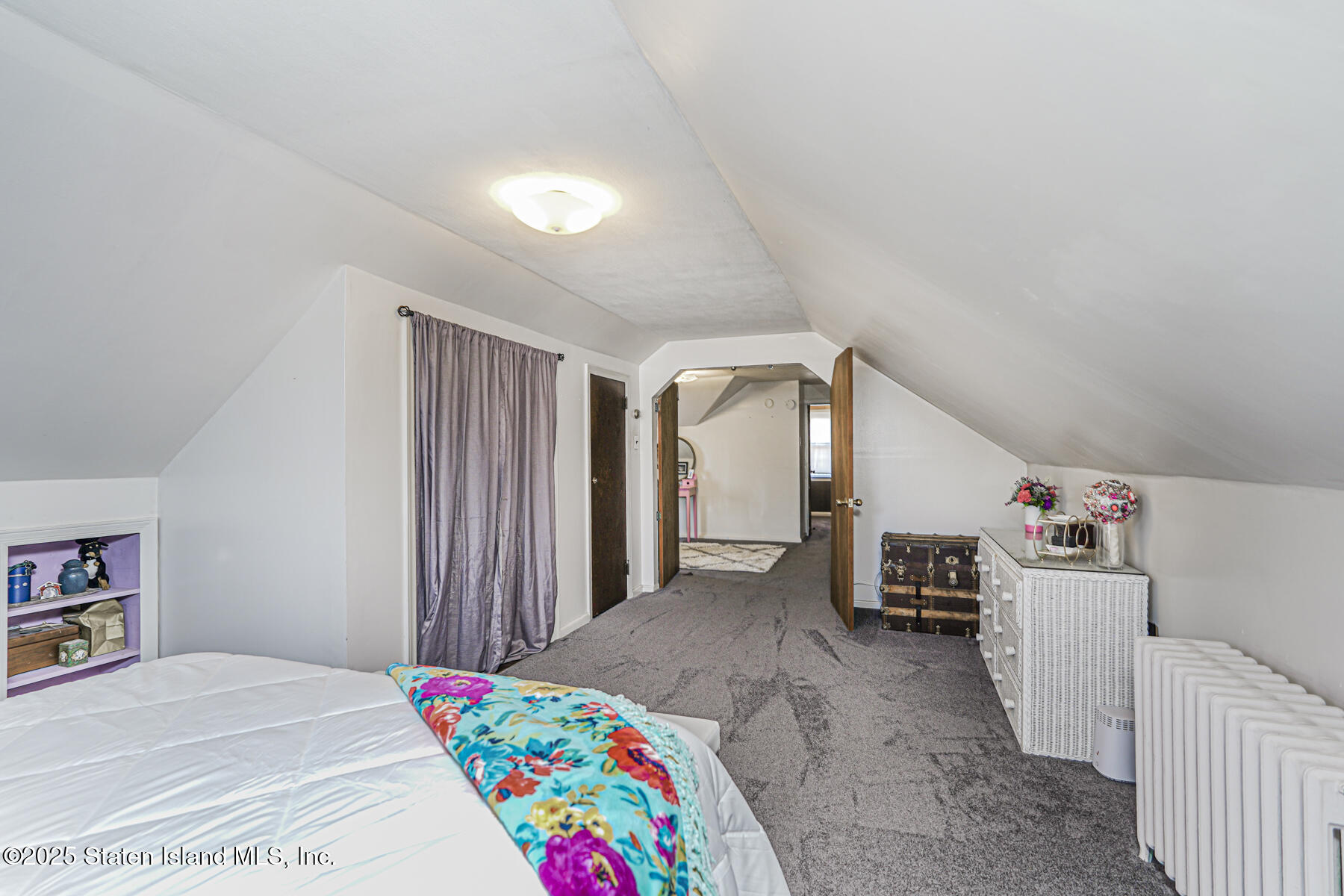 334 Neal Dow Avenue Staten Island, NY 10314 - Photo 24 of 37 a living room with furniture and a table