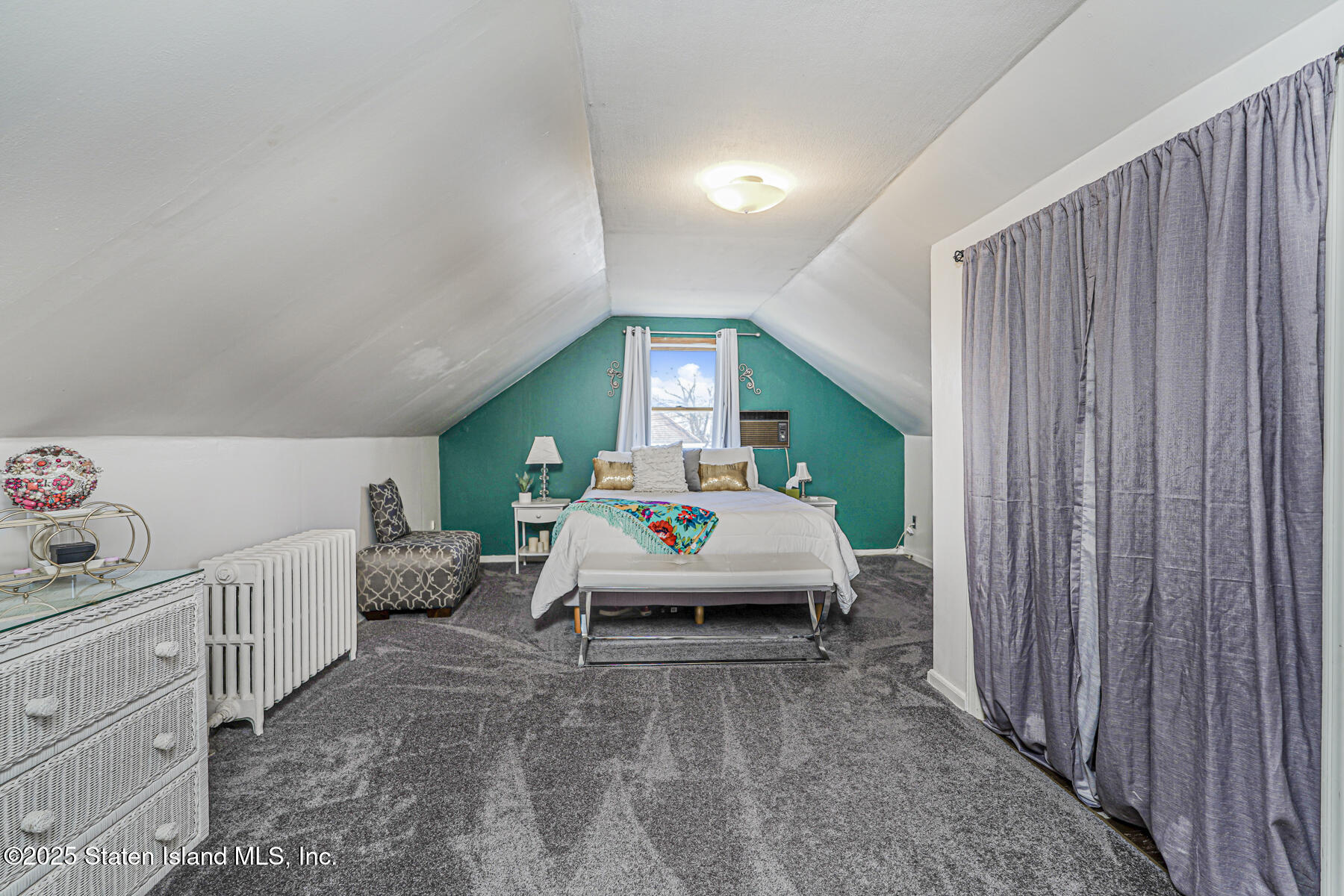 334 Neal Dow Avenue Staten Island, NY 10314 - Photo 25 of 37 a bedroom with furniture and a large window