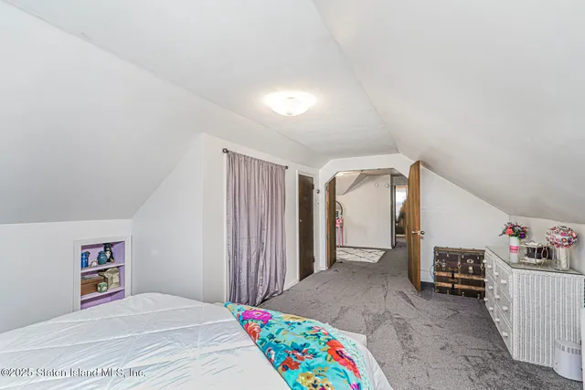 a view of a bedroom with baby toys and deck