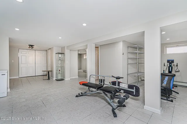 a view of a livingroom with workspace and a couch