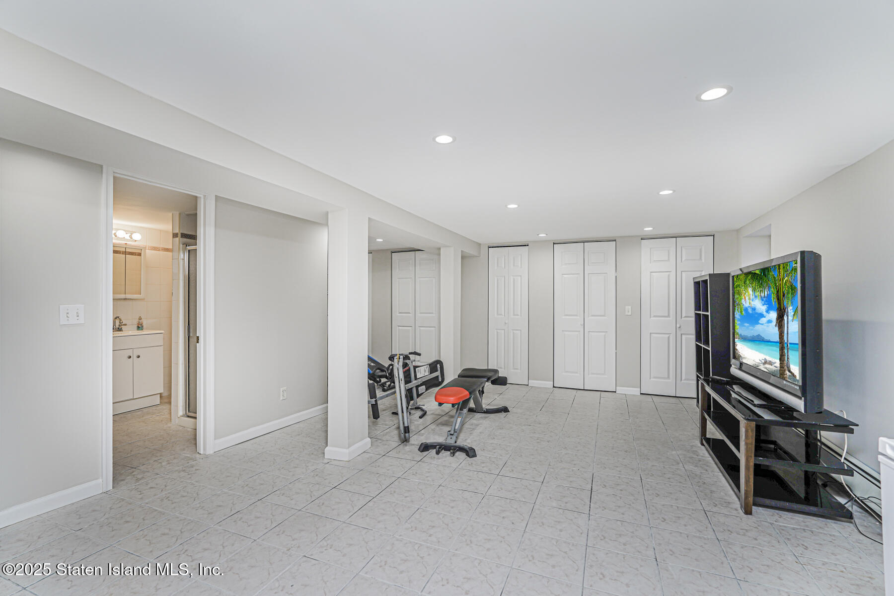 334 Neal Dow Avenue Staten Island, NY 10314 - Photo 32 of 37 a living room with furniture and a flat screen tv