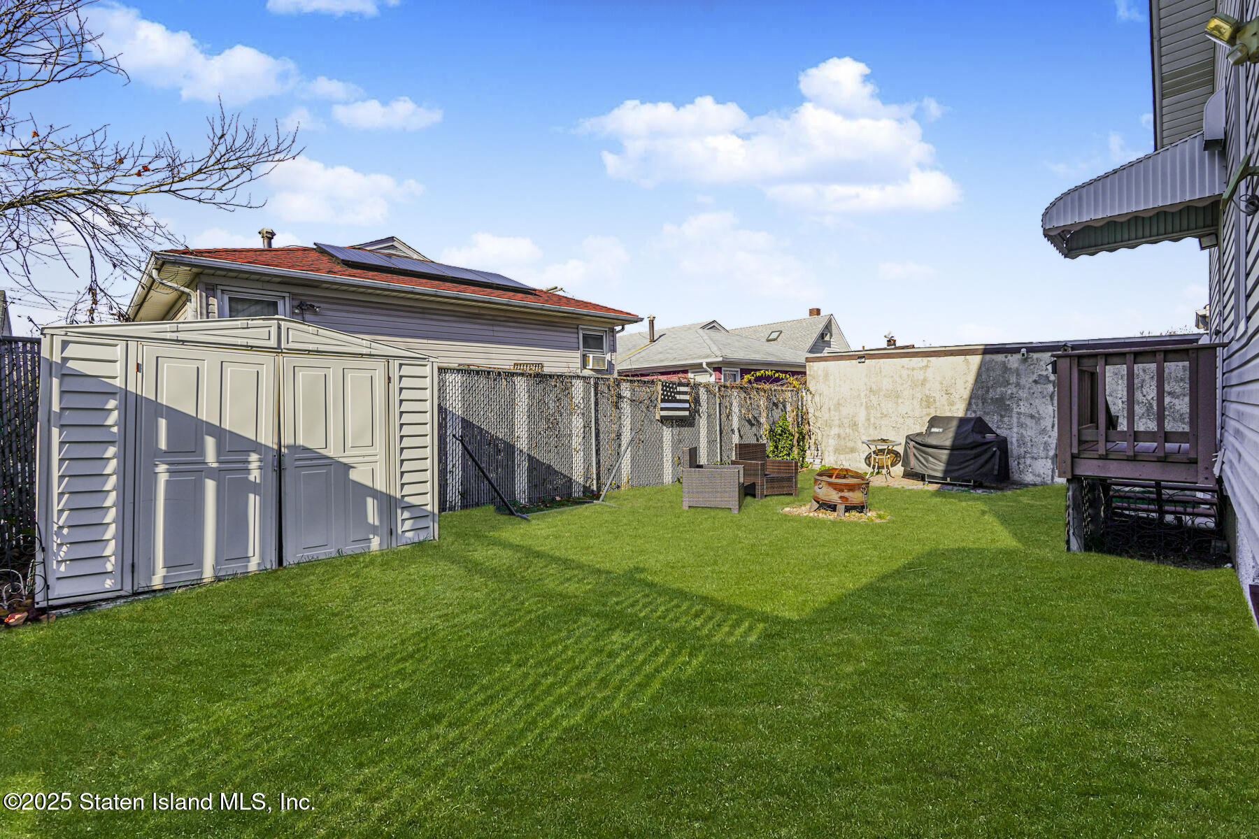 334 Neal Dow Avenue Staten Island, NY 10314 - Photo 36 of 37 a view of a porch with a yard