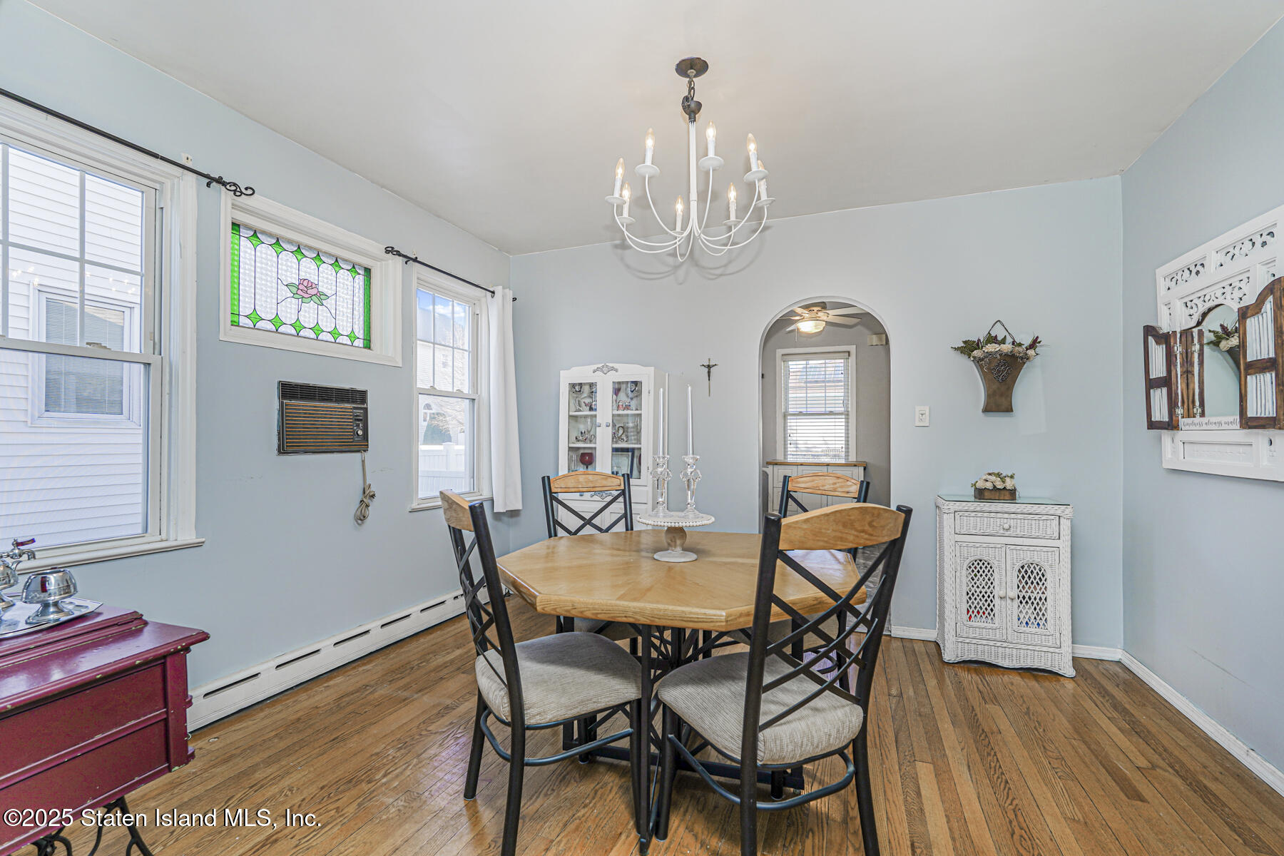 334 Neal Dow Avenue Staten Island, NY 10314 - Photo 9 of 37 a view of a dining room with furniture wooden floor and chandelier