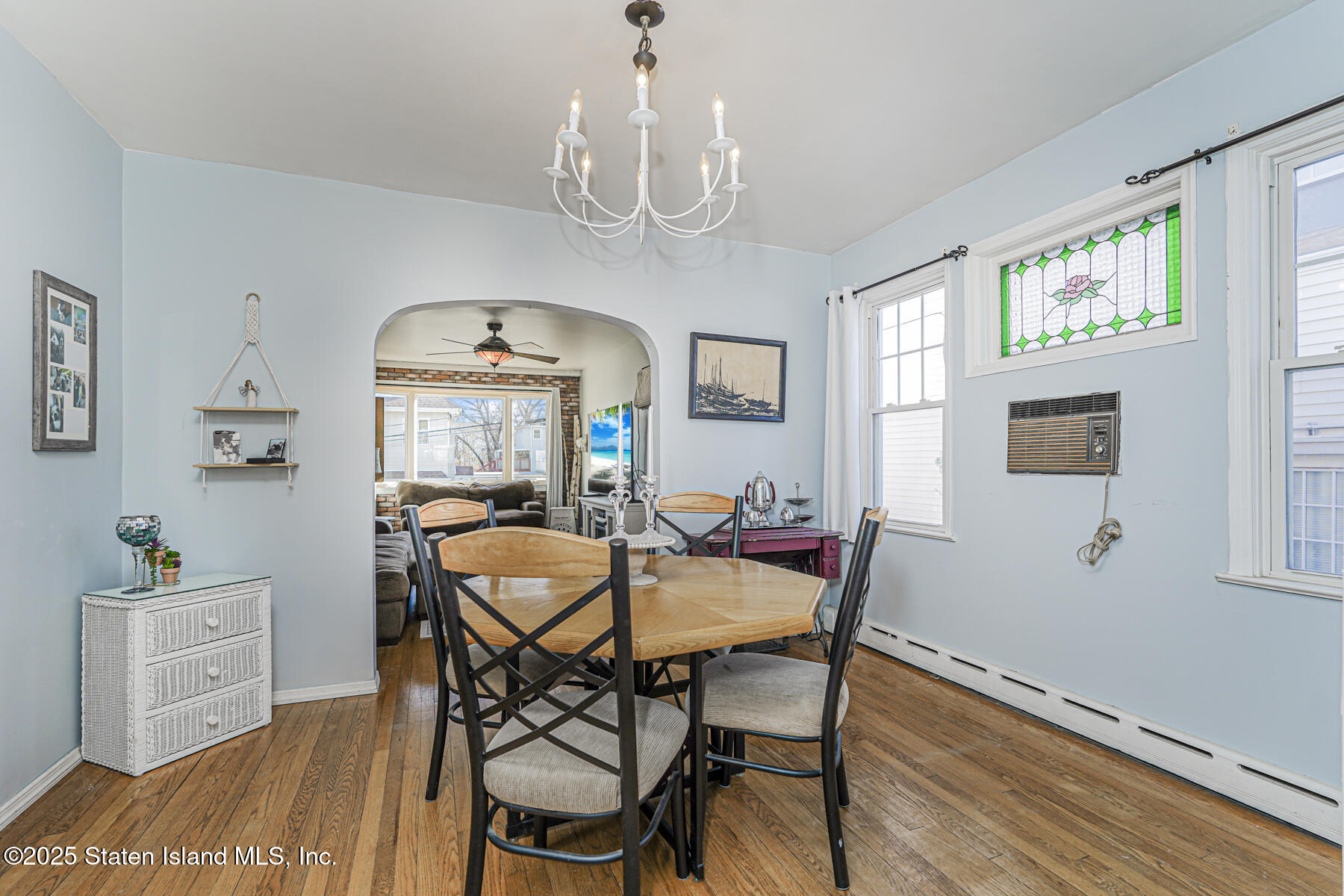 334 Neal Dow Avenue Staten Island, NY 10314 - Photo 10 of 37 a view of a dining room with furniture window and wooden floor