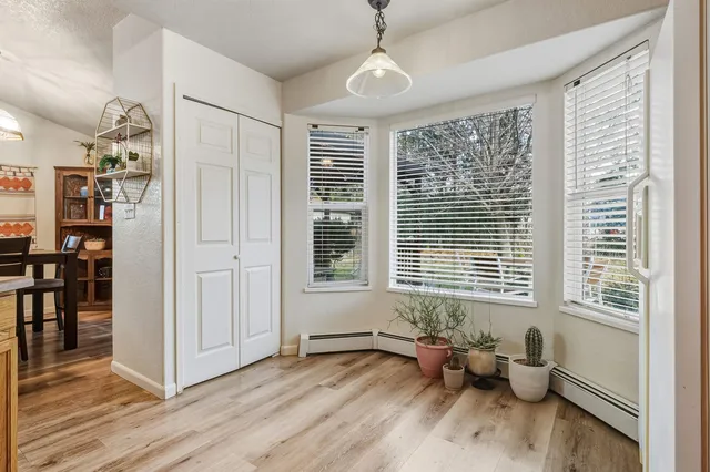 a bedroom with furniture and a window